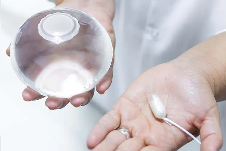 Gastric Balloon Pill and balloon in each hand